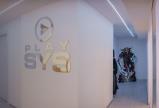 Lo studio milanese di PlaySys con il logo in bella mostra.